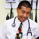  Picture of Dr Goo in a office with medical equipment in the background