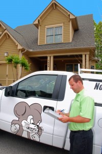 pest control van in front of a house
