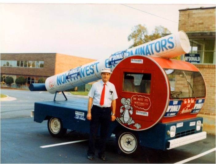 Northwest Exterminating founder L.A. Phillips in front of the old pump truck
