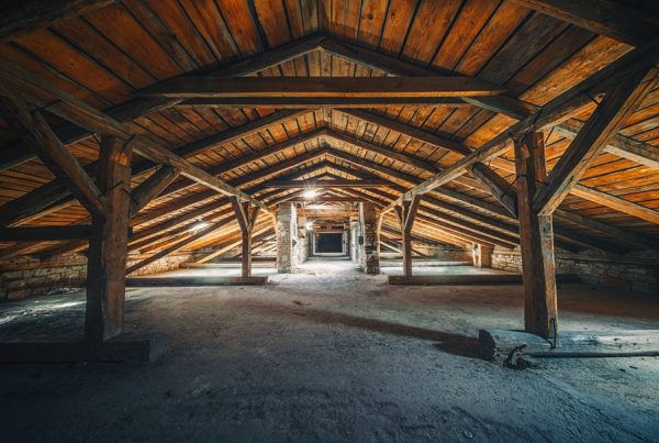 Creepy attic interior at abandoned industrial building