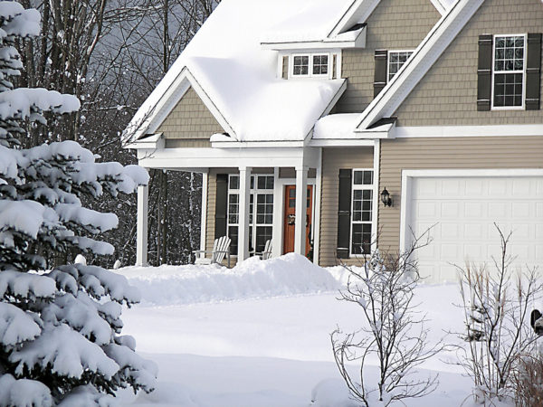 Winter home covered in snow