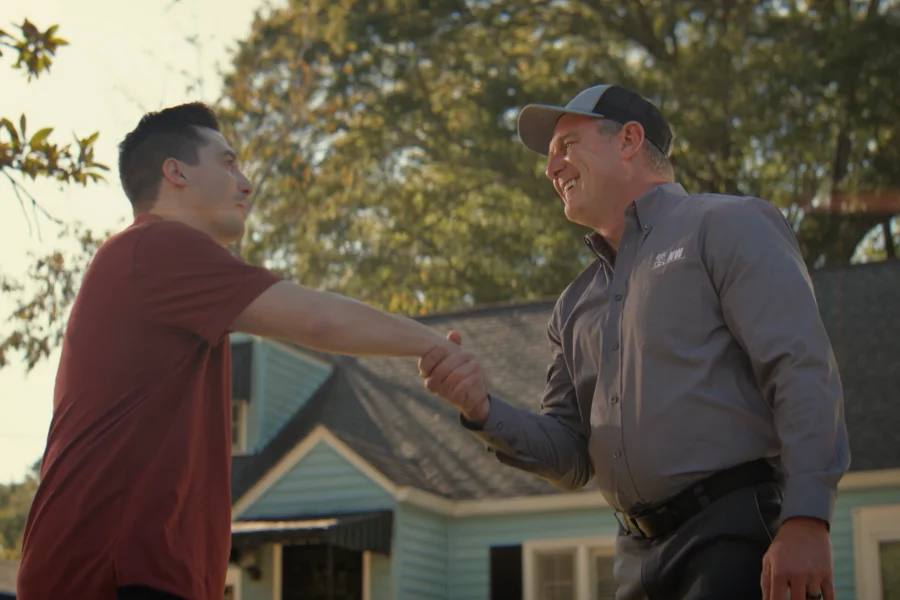 A Northwest Exterminating technician with a homeowner after inspecting a home for signs of a roach infestation.