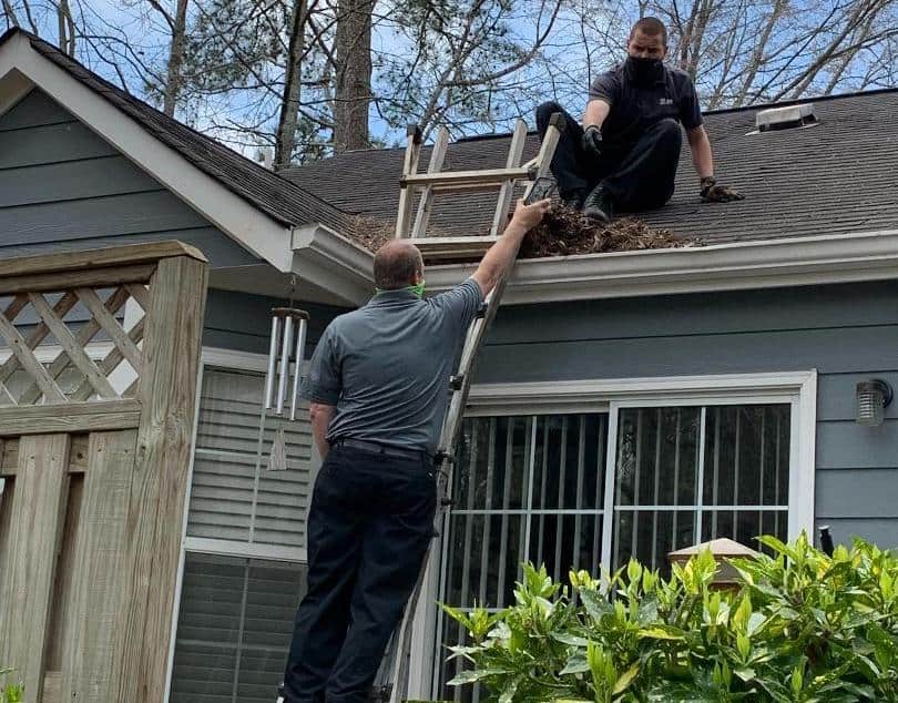 Northwest Exterminating Canton Service Center Helps Clean Out Gutters for Customer